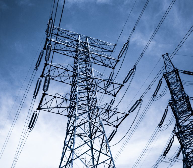 Close-up of an electricity pylon with power lines