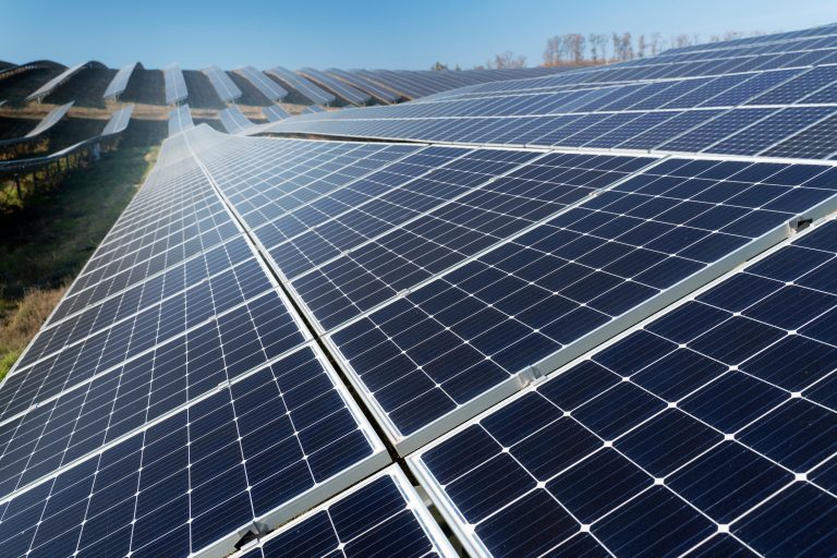 Solar panel array close-up with rows of photovoltaic cells